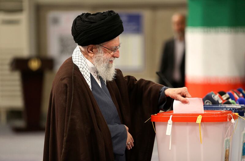 Mr Khamenei casts his ballot during the parliamentary and Assembly of Experts elections in Tehran. AP