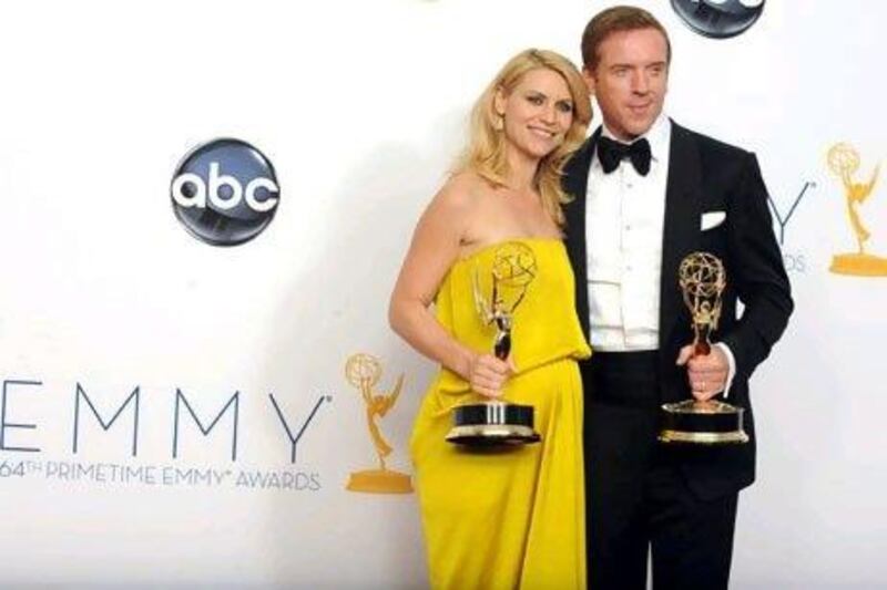 Claire Dane, left, and Damien Lewis won the awards for outstanding lead actor and actress in a drama series for Homeland. AP