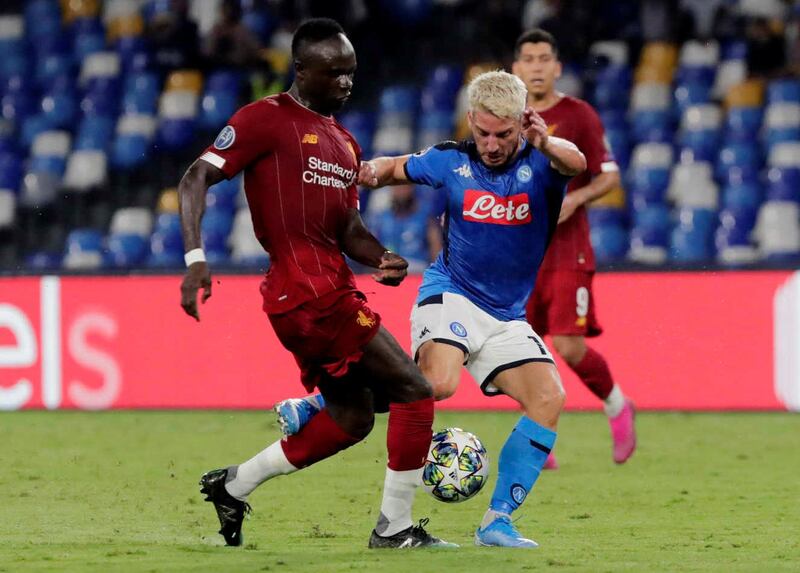 Napoli's Dries Mertens in action with Liverpool's Sadio Mane during Tuesday night's Champions League Group E match at the Stadio San Paolo in Naples, Italy. Napoli won the match 2-0. Reuters