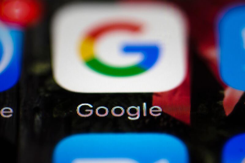 FILE  - This Wednesday, April 26, 2017 file photo shows a Google icon on a mobile phone, in Philadelphia. European Union antitrust chief Margrethe Vestager is planning a statement on Wednesday, July 18, 2018 amid reports that her office will slap a record $5 billion fine on Google for abuse of its dominant position in the Android mobile phone operating systems. The decision was widely expected this week and financial media, including Bloomberg and the Financial Times, said the amount would total 4.3 billion euros. (AP Photo/Matt Rourke, File)
