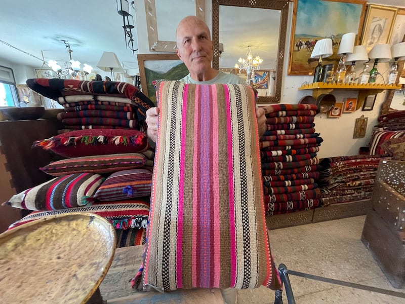 Mr Naouri with a Jordanian weaving partly made from old clothes