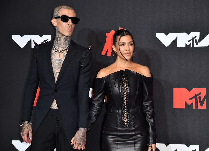 Drummer Travis Barker and personality Kourtney Kardashian arrive for the 2021 MTV Video Music Awards. AFP
