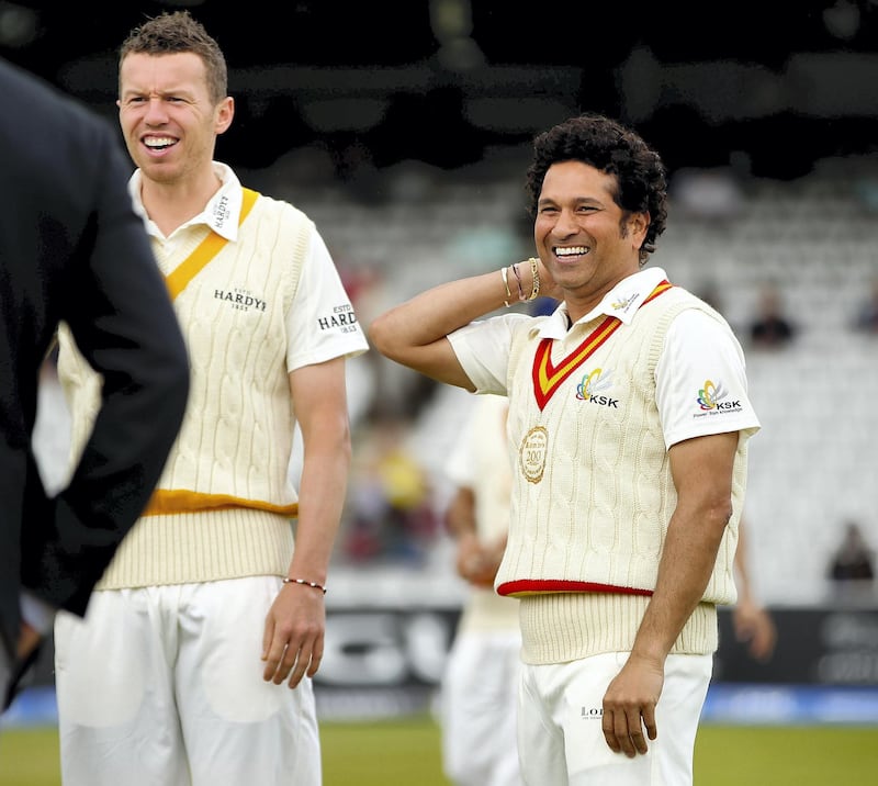 LONDON, ENGLAND - JULY 05: Peter Siddle (L) and Sachin Tendulkar (R) of MCC share a joke during the MCC and Rest of the World match at Lord's Cricket Ground on July 5, 2014 in London, England.  (Photo by Ben Hoskins/Getty Images)