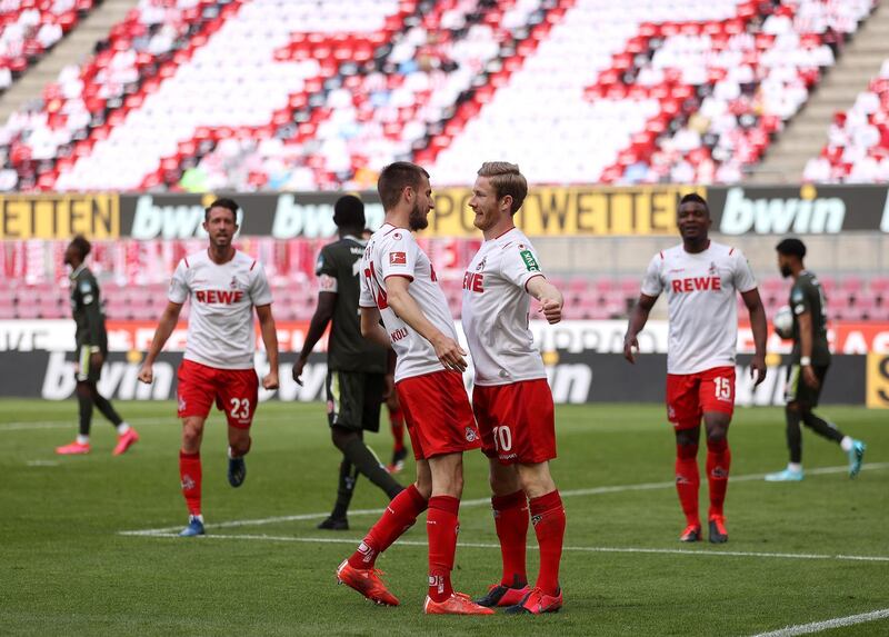 COLOGNE 2 MAINZ 2. Florian Kainz, right, celebrates with teammate Dominick Drexler after scoring his team's second goal at the RheinEnergieStadion on 17 May 2020. EPA