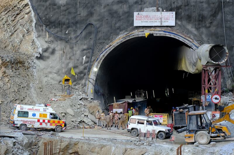 An ambulance arrives at the tunnel where workers are trapped. Reuters