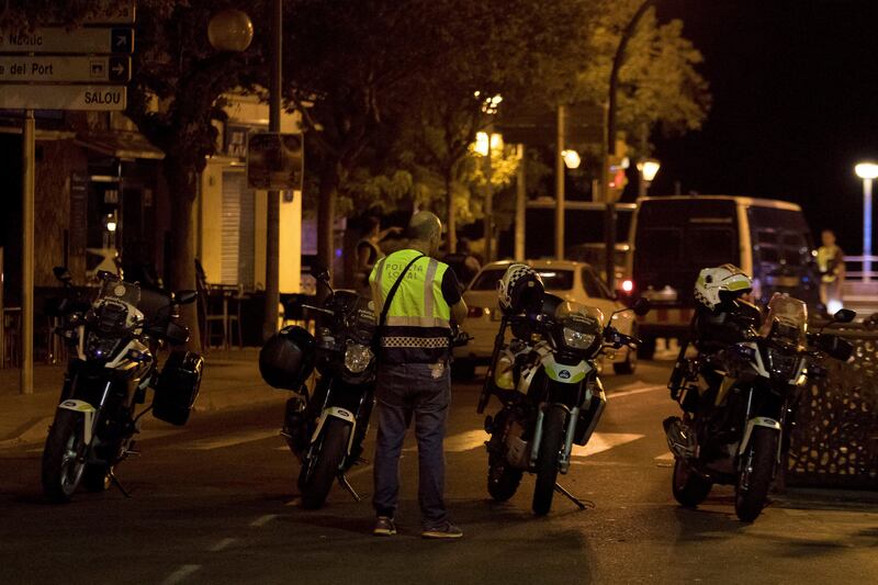 A police officer stands near the scene where police had killed four attackers in Cambrils, south of Barcelona, Spain, August 18, 2017. REUTERS/Stringer  NO RESALES. NO ARCHIVES