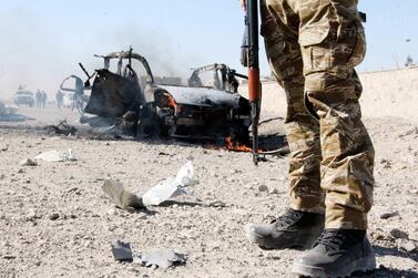 An Afghan security officer at the scene of an attack at the National Directorate of Security in Kandahar, Afghanistan, on January 16, 2021. EPA