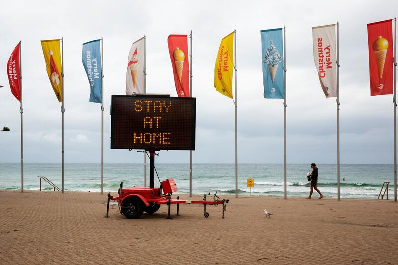 A Covid-19 stay at home sign is seen at Manly Beach in Sydney, Australia. Getty Images