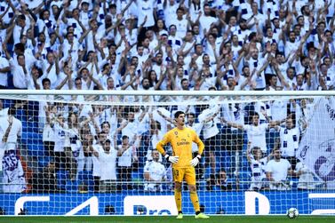 TOPSHOT - Real Madrid's Belgian goalkeeper Thibaut Courtois reacts during the UEFA Champions league Group A football match between Real Madrid and Club Brugge at the Santiago Bernabeu stadium in Madrid on October 1, 2019. / AFP / OSCAR DEL POZO