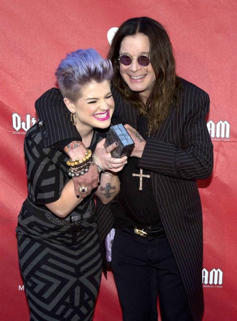 Musician Ozzy Osbourne and his daughter Kelly Osbourne pose at the 10th Annual MusiCares MAP Fund Benefit concert at Club Nokia in Los Angeles, California 12 May. Reuters 
