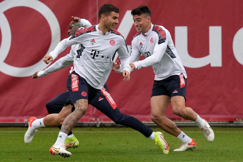 Bayern Munich's Lucas Hernandez, front, Marc Roca, right, and Bouna Sarr, rear left, attend a training session. AP Photo