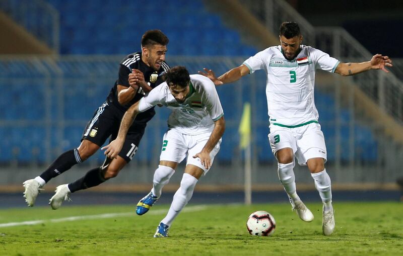 Iraq's Rebin Sulaka and Hussam Kadhim in action with Argentina's Eduardo Salvio during the Argentina vs Iraq football match at the Prince Faisal bin Fahd Stadium, Riyadh, Saudi Arabia. Reuters