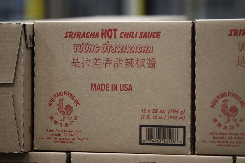 Boxes of Sriracha sauce move along a conveyer at the Huy Fong Foods Sriracha Hot Chili Sauce factory on May 14, 2014 in Irwindale, California. David McNew / Getty Images / AFP