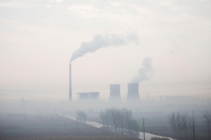 Smoke bellows from a power plant on a polluted day in Cangzhou, some 180 kms from Beijing, in northern China's Hebei province. AFP