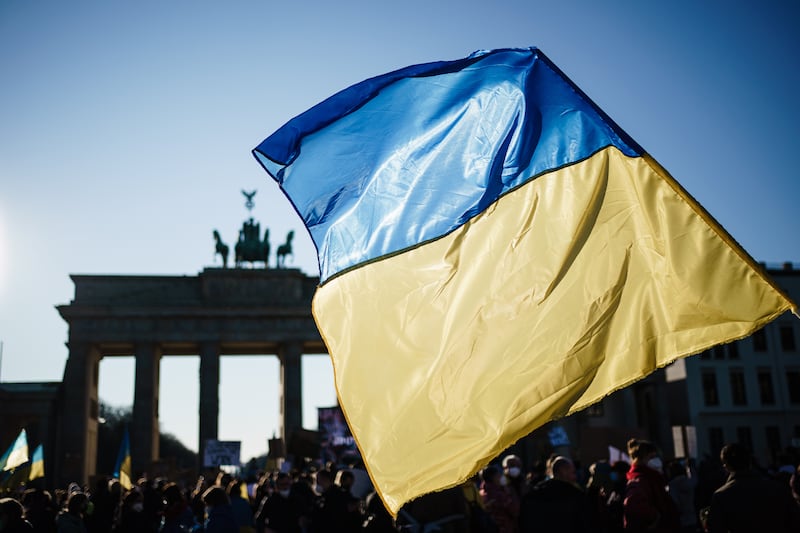A protester waves a Ukrainian flag during a rally in front of the Brandenburg Gate in Berlin, Germany, on March 13. EPA