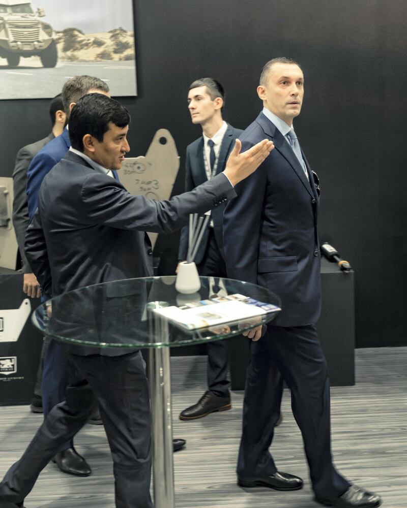 Inkas's chief executive Ulugbekhon ­Maksumov shows a customer around the stand. Olga Voronova / Inkas