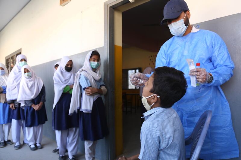 Testing schoolchildren in Karachi. EPA