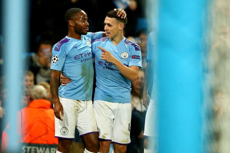 Phil Foden celebrates with Raheem Sterling after scoring Manchester City's second goal. AP Photo