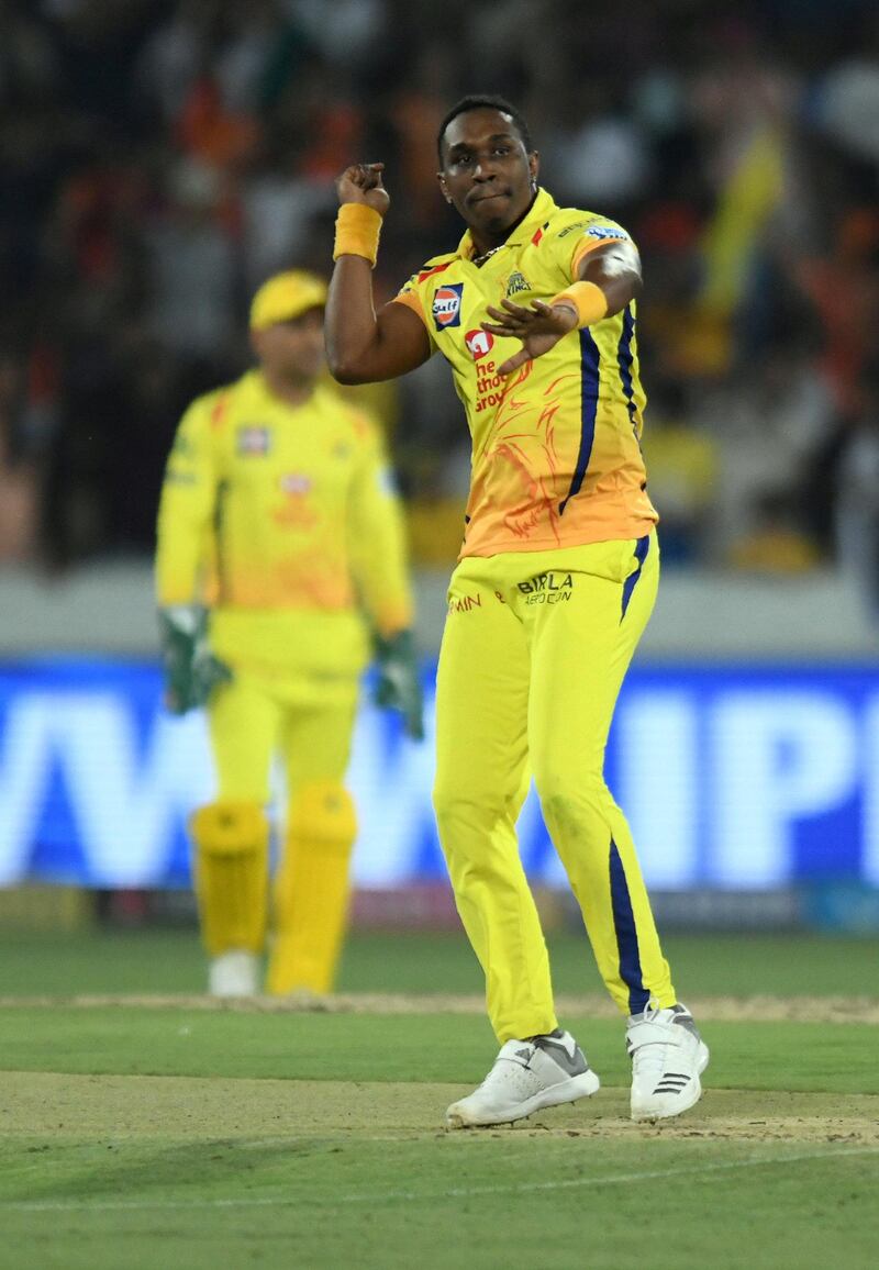 Chennai Super Kings cricketers Dwayne Bravo celebrates after their win against Sunrisers Hyderabad during the 2018 Indian Premier League (IPL) Twenty20 cricket match between Sunrisers Hyderabad and Chennai Super Kings at the Rajiv Gandhi International Cricket Stadium in Hyderabad on April 22, 2018. (Photo by NOAH SEELAM / AFP) / ----IMAGE RESTRICTED TO EDITORIAL USE - STRICTLY NO COMMERCIAL USE----- / GETTYOUT