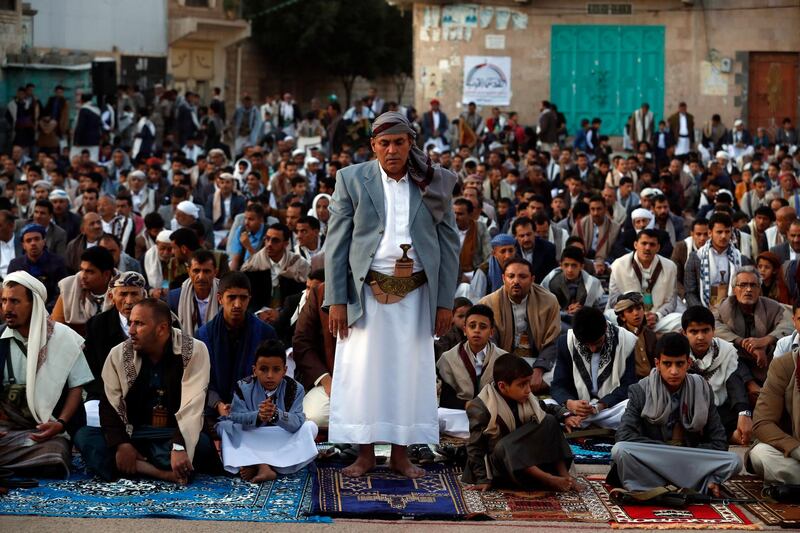 Yemeni men and boys attend Eid prayers in Sanaa. EPA