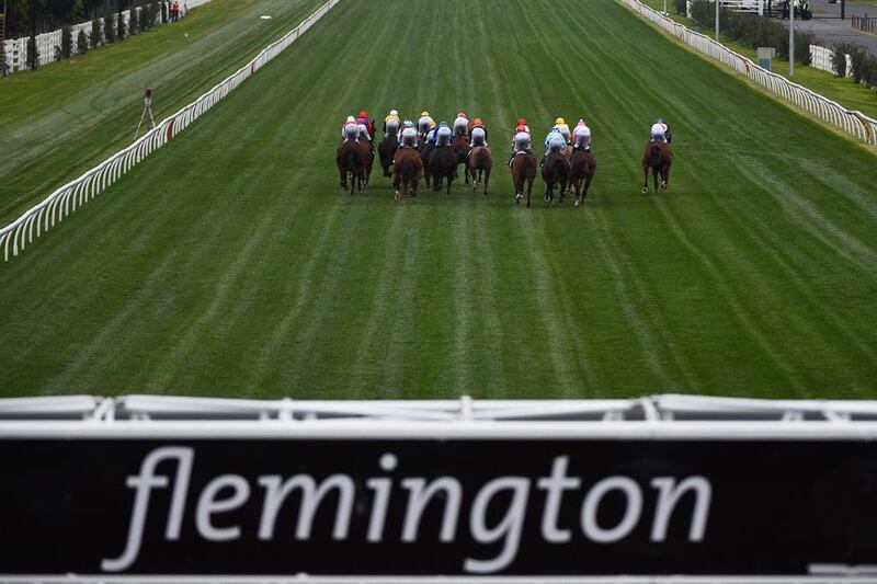 General view of horses racing up the straight in Race 9 during Melbourne racing at Flemington Racecourse in Melbourne, Australia. Vince Caligiuri / Getty Images