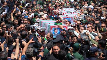 Mourners carry the coffin of late Iranian President Ebrahim Raisi, during his burial ceremony in Mashhad, Iran. Reuters