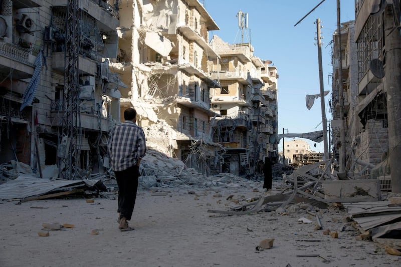 A Syrian man walks past a heavily damaged building following air strikes on rebel-held eastern areas of Aleppo on September 24, 2016.
Heavy Syrian and Russian air strikes on rebel-held eastern areas of Aleppo city killed at least 25 civilians on Saturday, the Britain-based Syrian Observatory for Human Rights said, overwhelming doctors and rescue workers. / AFP PHOTO / KARAM AL-MASRI