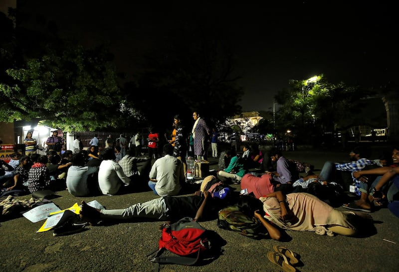 Students sit inside a Madras University compound during a protest in Chennai. Reuters