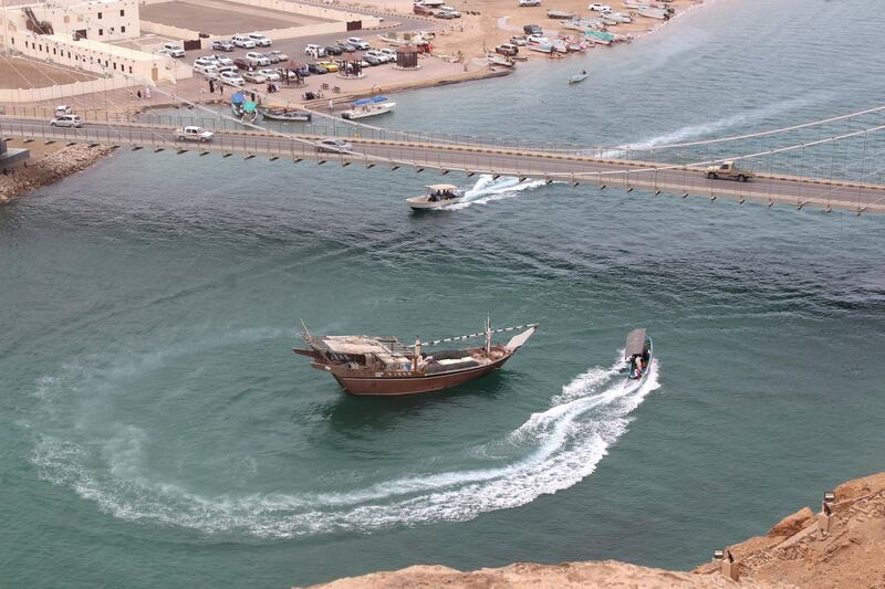 Speed boats circle around a dhow cruise in Sur, Oman. Titus Varughese for The National