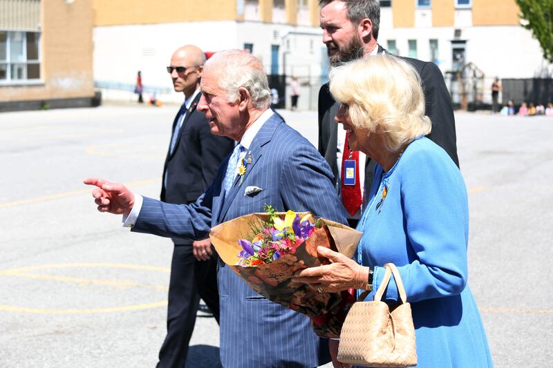 Britain's Prince Charles and Camilla, Duchess of Cornwall greets students during a visit at Assumption Catholic school May 18, 2022 in Ottawa. AFP