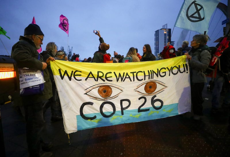 Extinction Rebellion environmental activists hold a protest outside the venue hosting Cop26 in Glasgow, Scotland. Reuters