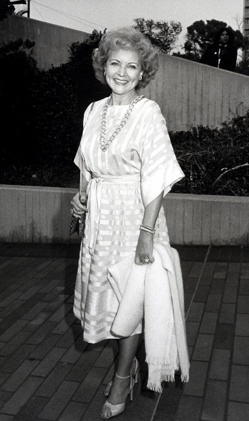 Betty White, in a white satin striped dress, attends the NBC Affiliates Party on May 16, 1983. Getty Images