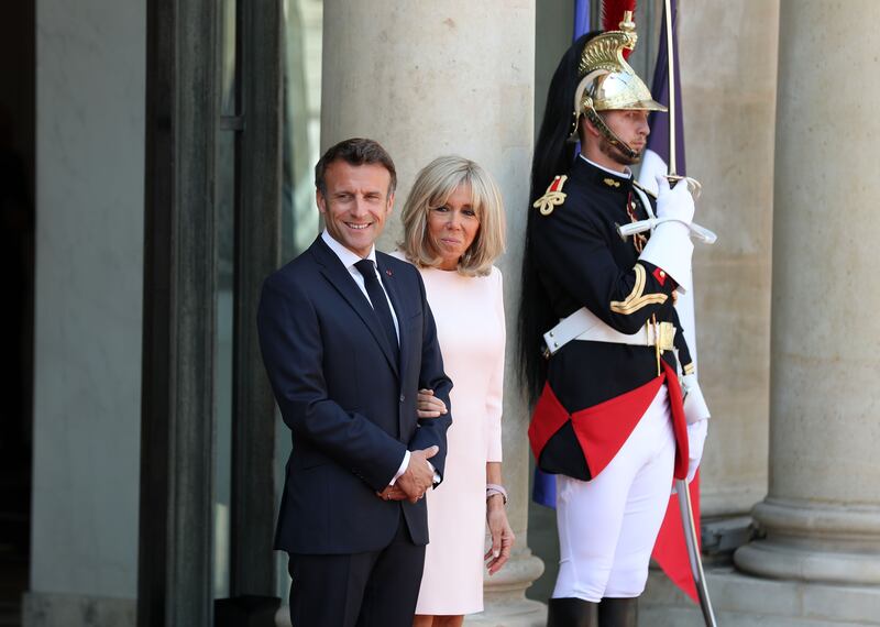 Emmanuel and Brigitte Macron pictured shortly before Sheikh Mohamed's arrival.