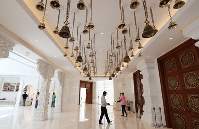 More than 100 brass bells decorate a corridor leading to the main prayer hall. Chris Whiteoak / The National