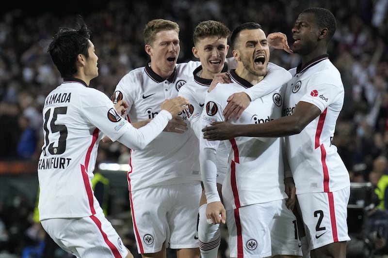 Frankfurt's Filip Kostic celebrates with teammates after scoring the opening goal in the 3-2 win at Barcelona in their Europa League quarter-final second leg. EPA