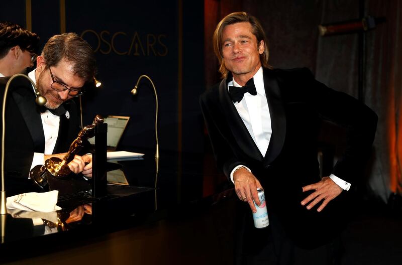 Best Supporting Actor Brad Pitt waits for his Oscar statue to be engraved  at the Governors Ball after the Oscars on Sunday, February 9, 2020, at the Dolby Theatre in Los Angeles. Reuters