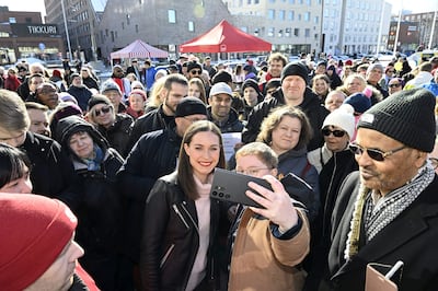 Finland's Prime Minister Sanna Marin poses with supporters during a rally in Vantaa on Friday. AFP 