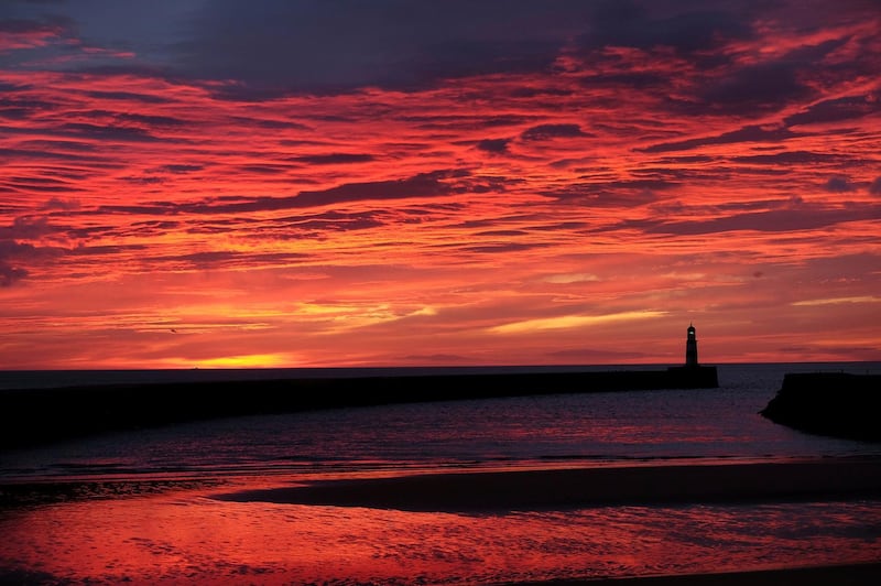 The sun rises over Seaham harbour, County Durham, England. Owen Humphreys / AP Photo