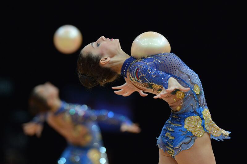 TOPSHOTS
Team Bulgaria performs during the group all-around final of the rythmic gymnastics event of the London Olympic Games on August 12, 2012 at Wembley arena in London.  AFP PHOTO / BEN STANSALL
 *** Local Caption ***  237634-01-08.jpg