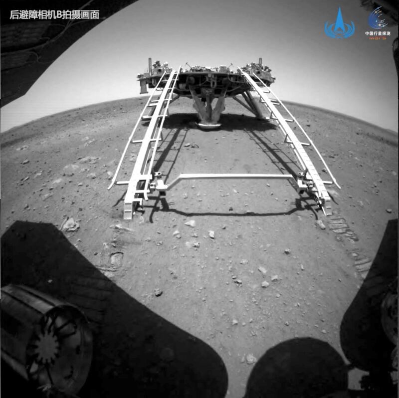 Chinese rover Zhurong of the Tianwen-1 mission drives down the ramp of the lander onto the surface of Mars, in this screenshot taken from a video released by China National Space Administration (CNSA) May 22, 2021. CNSA/Handout via REUTERS  ATTENTION EDITORS - THIS IMAGE WAS PROVIDED BY A THIRD PARTY. NO RESALES. NO ARCHIVES.