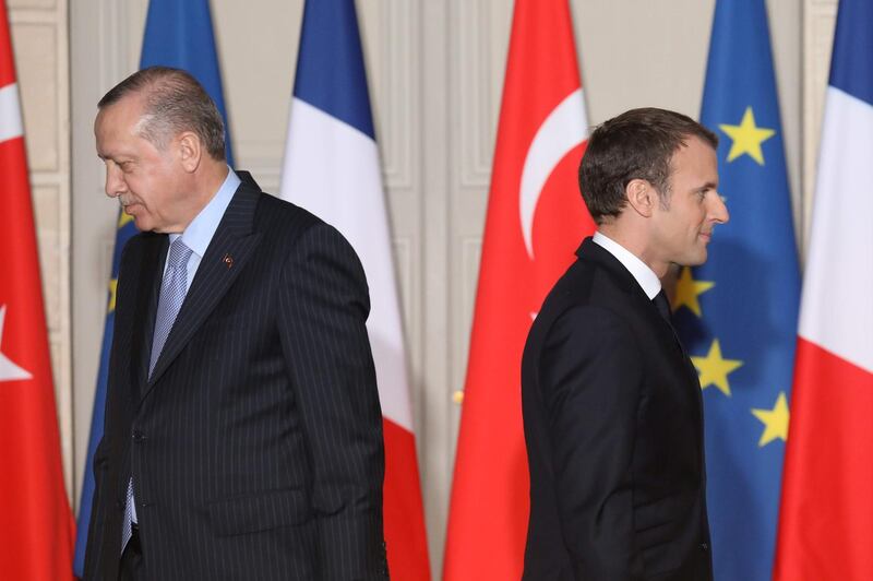 (FILES) In this file photo taken on January 5, 2018 French President Emmanuel Macron (R) and  Turkish President Recep Tayyip Erdogan walk during a joint press conference at the Elysee Palace in Paris. Turkish President Recep Tayyip Erdogan slammed on October 24, 2020 his French counterpart, Emmanuel Macron, over his policies toward Muslims, saying that he needed "mental checks." "What can one say about a head of state who treats millions of members from different faith groups this way: first of all, have mental checks," Erdogan said in a televised address.
 / AFP / POOL / LUDOVIC MARIN
