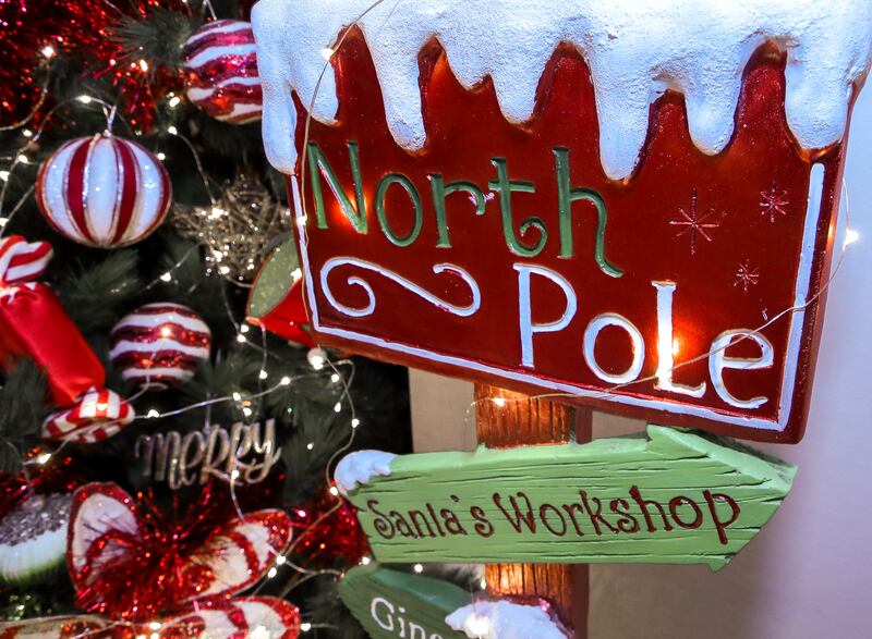 North Pole signage beside the Christmas tree