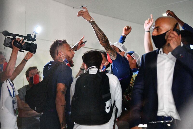 Paris Saint-Germain's Brazilian forward Neymar (L) celebrates with teammates at the PSG team hotel in Lisbon. AFP
