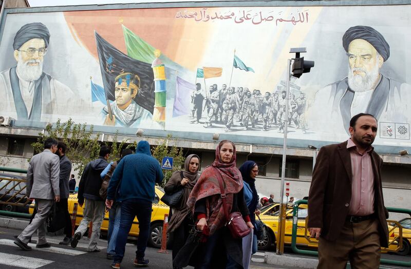 epa07138461 Iranians walk past a mural depicting Iranian supreme leader Ayatollah Ali Khamenei (L, top) and late Iranian supreme leader Ayatollah Ruhollah Khomeini (R, top) in a street of Tehran, Iran, 03 November 2018. US President Donald J. Trump's administration announced on 02 November 2018, that it will reimpose sanctions against Iran that had been waived under the 2015 Iran nuclear deal (the Joint Comprehensive Plan of Action, JCPOA). The US sanctions will take effect on 05 November 2018, covering Iran's shipping, financial and energy sectors. In 2015, five nations, including the United States, worked out a deal with the Middle Eastern country that withdrew the sanctions, one of former US President Barack Obama's biggest diplomatic achievements.  EPA/ABEDIN TAHERKENAREH