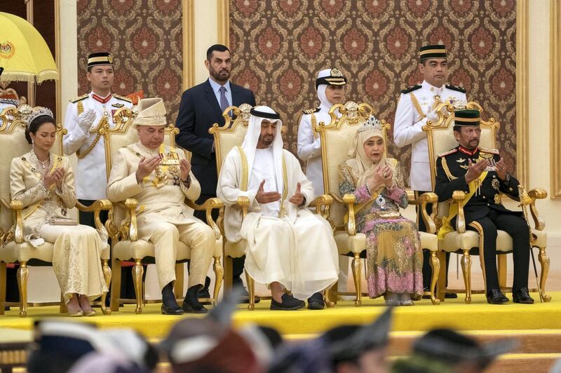 Sheikh Mohamed prays at the coronation of Malaysia's new king Sultan Abdullah.