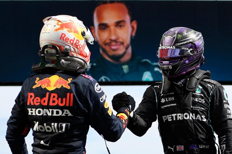 Mercedes driver Lewis Hamilton is congratulated by Red Bull's Max Verstappen who finished second in Portugal. EPA