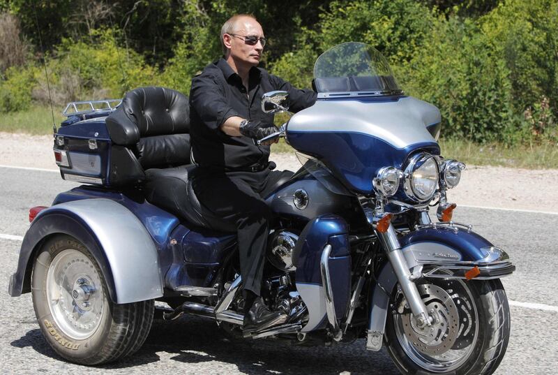 Putin rides Harley Davidson Lehman Trike as he leaves the meeting with motorbikers in Ukraine's Crimea Peninsula on July 24, 2010. AFP