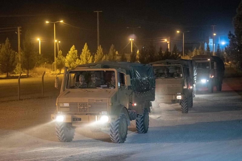 Turkish army soldiers drive towards the border with Syria near Akcakale in Sanliurfa province.  AFP