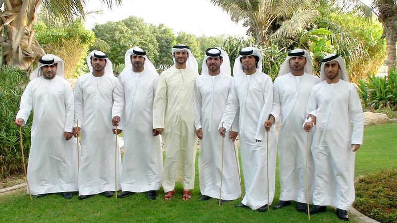 Mohammed Al Meqbali, fourth from right, the leader of Sokoor Al Magabeel, an Emirati dance troupe. Courtesy Sokoor Al Magabeel