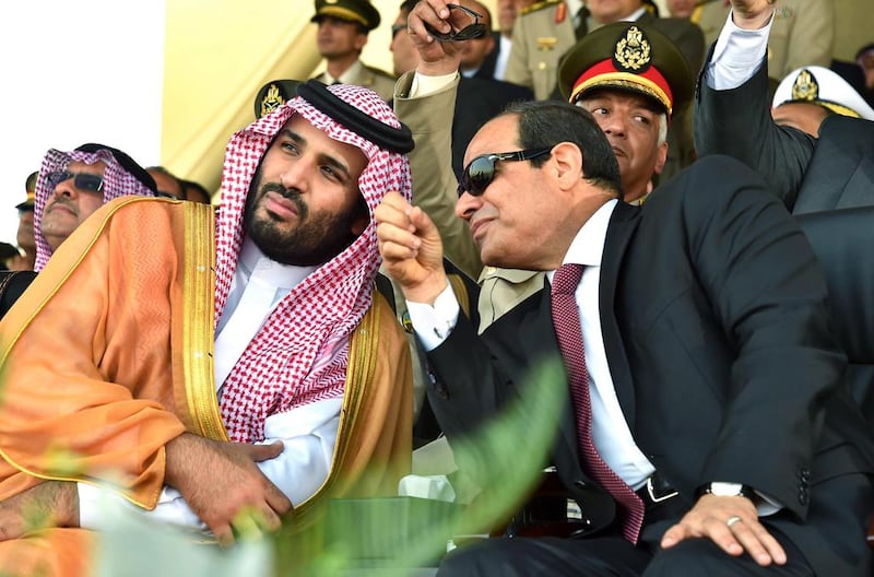 Egyptian president Abdel Fattah El Sisis (R) sits with Saudi Deputy Crown Prince and minister of defence Mohammed bin Salman during a graduation ceremony of a military academy in Cairo on July 30, 2015. EPA/Office of the Egyptian president/Handout